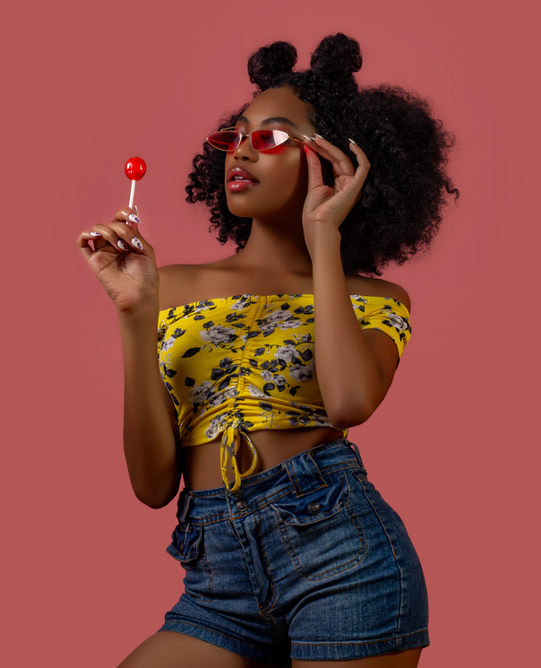 Woman Holding Red Lollipop